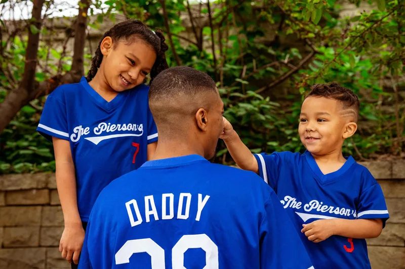 father and children playing outside